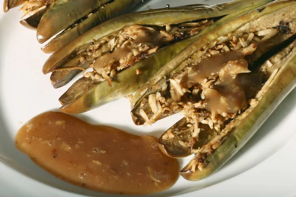 Ginger Tamarind Eggplant - A Eggplant (brinjal) in ginger tamarind sauce. — Stock Photo, Image