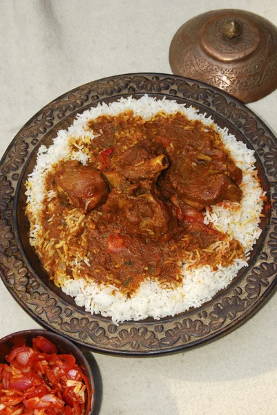 Rogan josh is an aromatic curry made of lamb or goat cooked in fresh spices — Stock Photo, Image