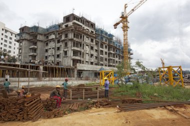 Bangalore, Karnataka, India - September 15, 2010: Unidentified workers are employed in construction overhead metro in bangalore City