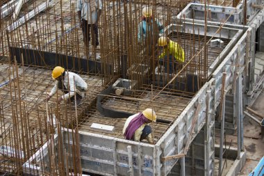 Bangalore, Karnataka, India - September 15, 2010: Unidentified workers are employed in construction overhead metro in bangalore City