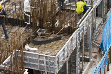 Bangalore, Karnataka, India - September 15, 2010: Unidentified workers are employed in construction overhead metro in bangalore City