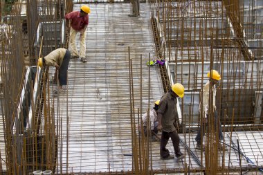 Bangalore, Karnataka, India - September 15, 2010: Unidentified workers are employed in construction overhead metro in bangalore City