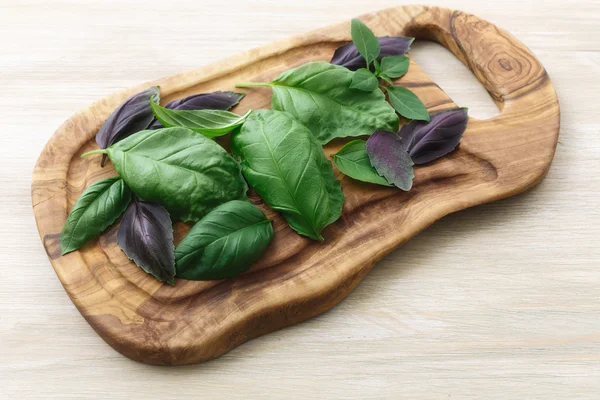 Heirloom basil on wooden table — Stock Photo, Image