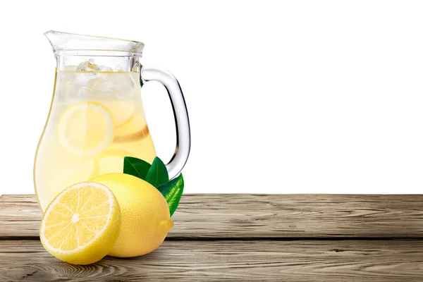 Lemonade pitcher on wooden table — Stock Photo, Image