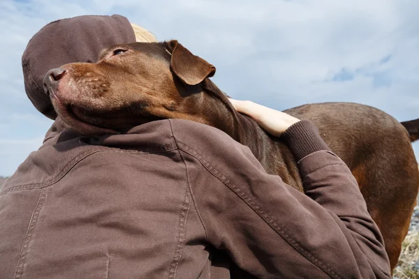 Dog hugging — Stock Photo, Image