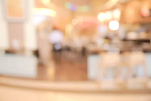 Abstract blurry bright empty restaurant with unrecognizable people — Stock Photo, Image