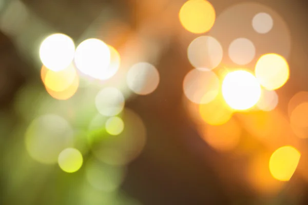 Abstracte donkere achtergrond met kleurrijke heldere bokeh — Stockfoto