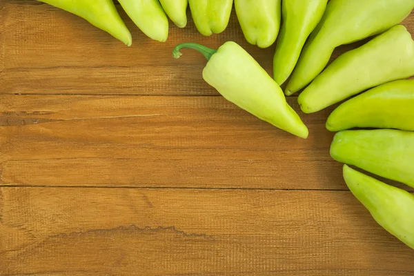 Set of hot green chilli pepper over wooden background — Stock Photo, Image
