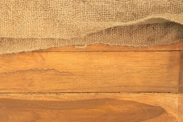 Старый мешок на фоне деревянной доски — стоковое фото