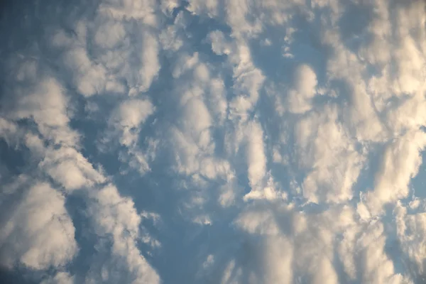 Abstract yellow cloud over blue sky background — Stock Photo, Image