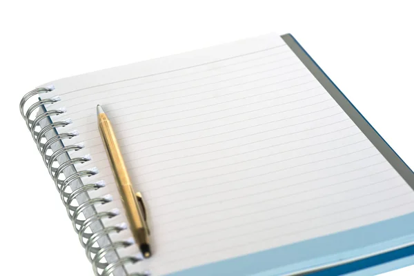 Shallow DOF of empty strip line notebook with twisted gold pen on left side of page isolated on white background — Stockfoto