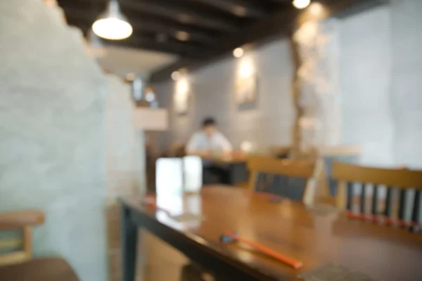 Abstract blurry restaurant with unrecognizable customer — Stock Photo, Image