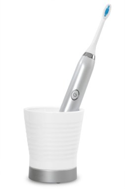 Electric tooth brush on a white background clipart