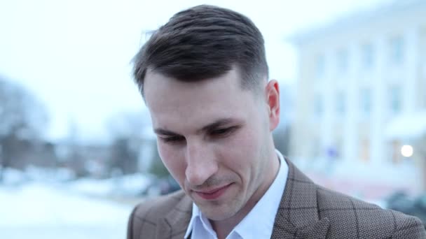 Portrait of a brutal guy standing on the street looking at the camera — Stock Video