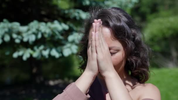 Close-up of an Asian woman doing yoga breathing exercises. Harmony concentration activity nature is healthy. Relaxation — Stock Video