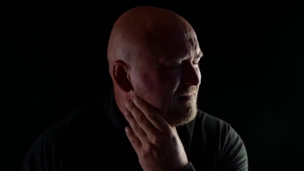 Close-up portrait of a depressed bald aged man crying. Depression, malaise, sadness — Stock Video