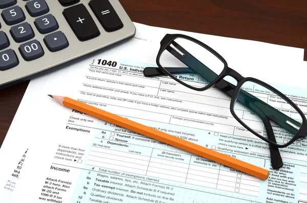 Preparazione fiscale - IRS finanziario Dichiarazione dei redditi individuale 1040 Modulo Foto Stock