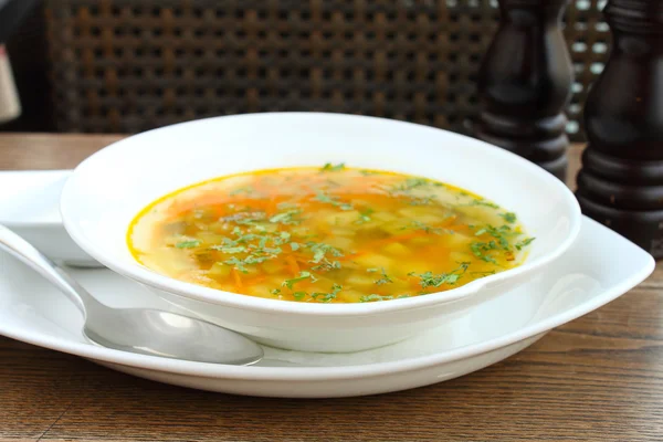 Tasty pickle soup in white plate — Stock Photo, Image