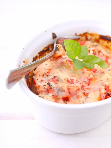 Chicken baked with tomatoes and cheese — Stock Photo, Image