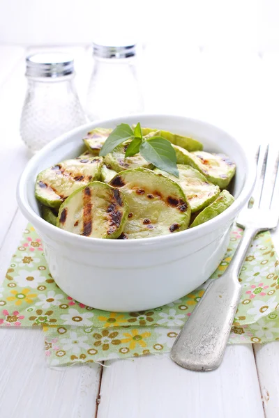 Grilled zucchini in a white plate — Stock Photo, Image