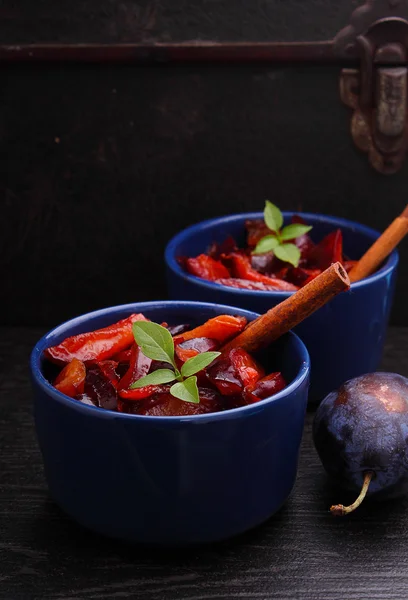 Dessert, stewed plums with cinnamon — Stock Photo, Image