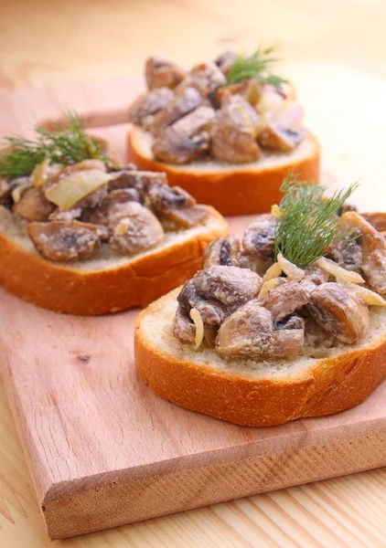 Delicious toasts with mushrooms — Stock Photo, Image