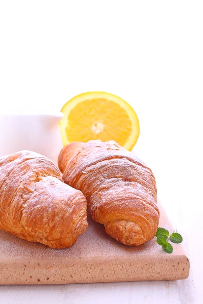 Croissants for breakfast on  board — Stock Photo, Image