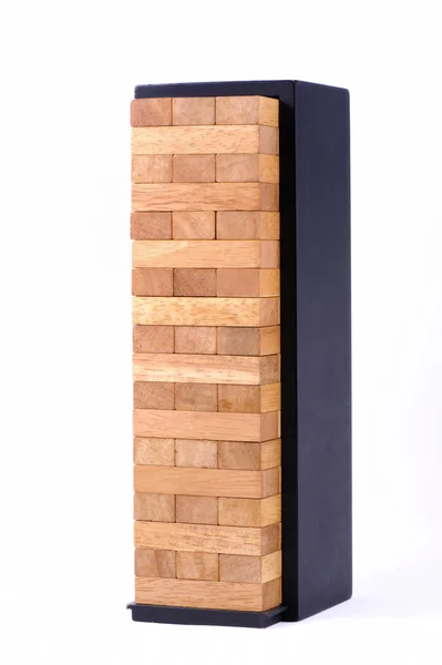 Dřevěné hra (jenga) bloky s černou skříňku izolátu — Stock fotografie