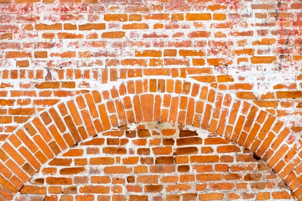 Red brick laying, tightly laid arch in the wall, background