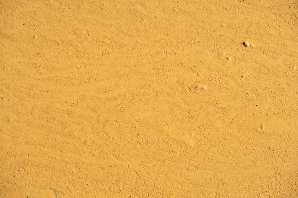 Liquid concrete mass, the base of the freeway is being poured, slightly changed color, background