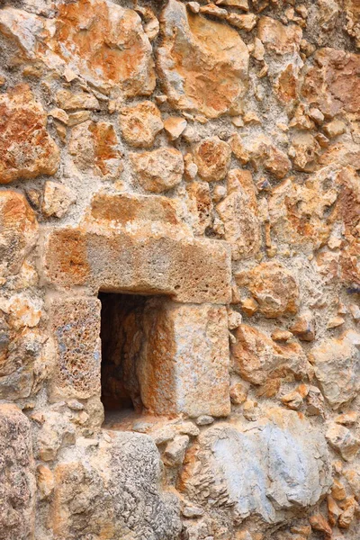 Window in the old fortress wall masonry, historical background