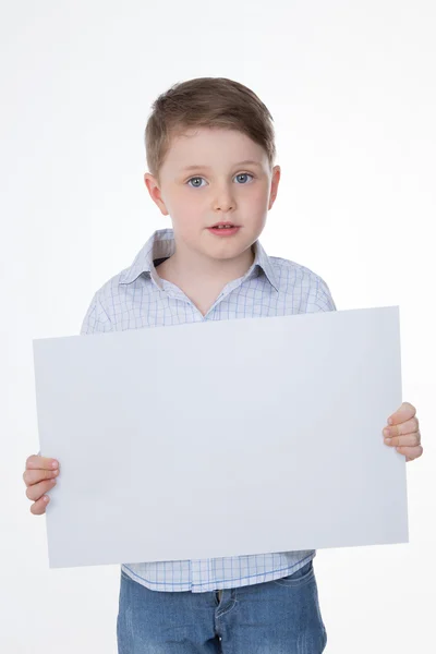 Clever boy holding blank panel — Stock Photo, Image