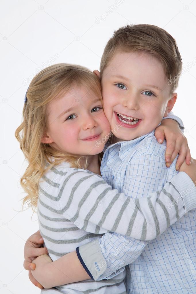 children hugging on white background
