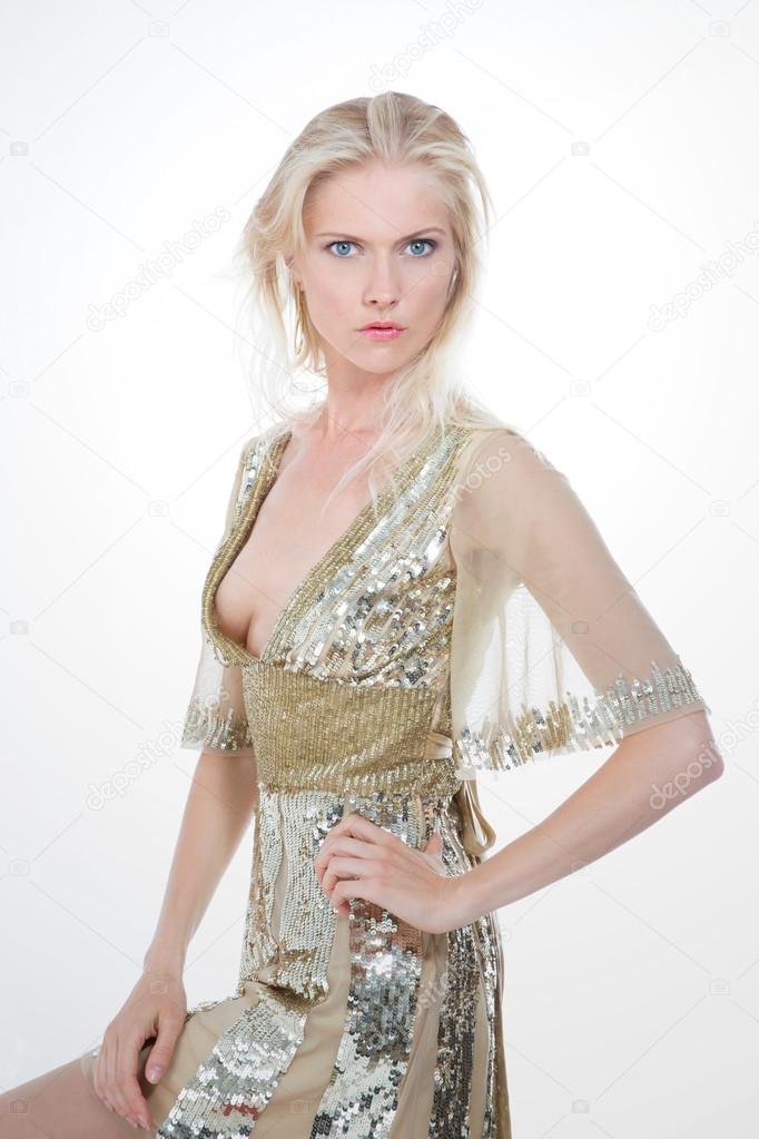 nordic girl in gold dress laying