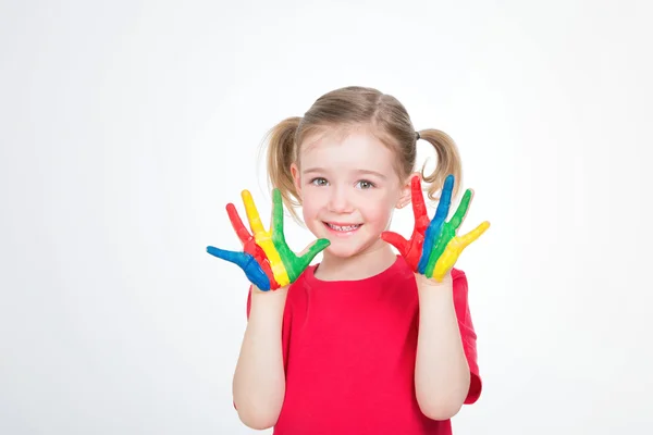 Jong meisje met gekleurde handen — Stockfoto