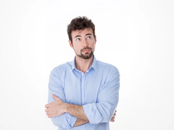 Man looking up with arms crossed — Stock Photo, Image