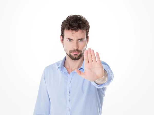 Young man with miking stop with his hand — Stock Photo, Image