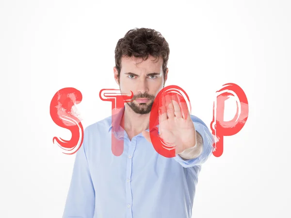 Serious man making stop sign behind a red writing — Stock Photo, Image