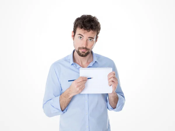 Jonge man een punt waarop zijn witte notebook — Stockfoto