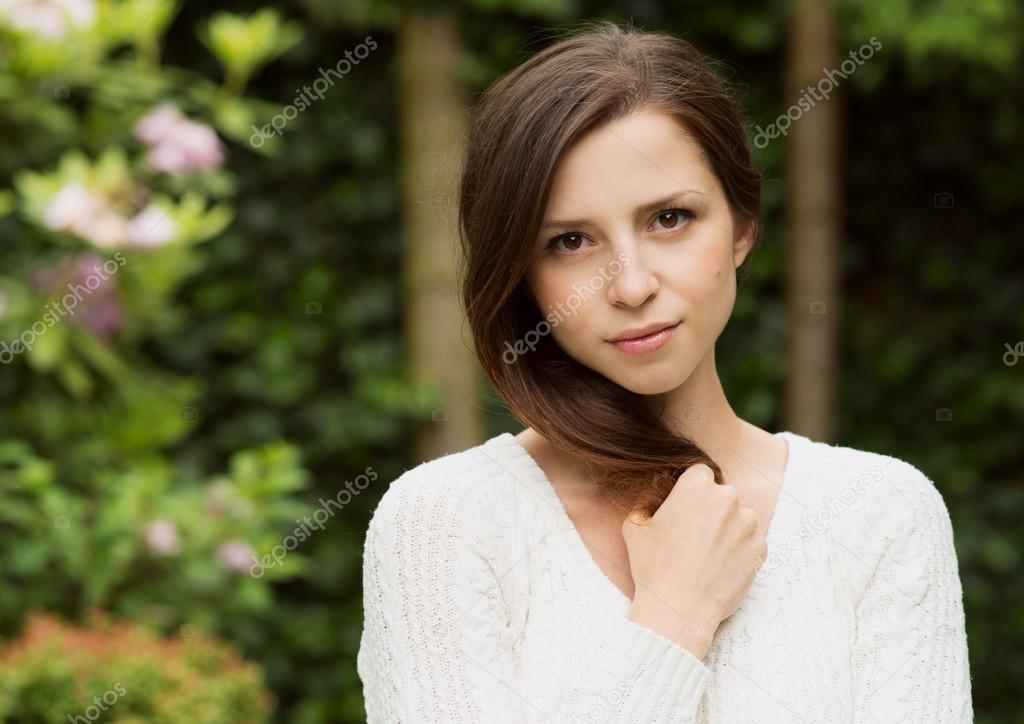 portrait of beautiful woman at green