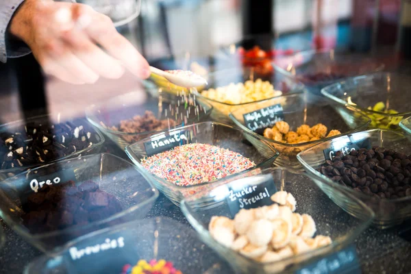 Frozen yogurt toppings bar. Yogurt toppings ranging from fresh f — Stock Photo, Image