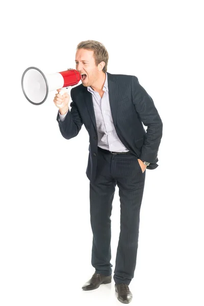 Handsome man in suit shouting in megaphone — Stock Photo, Image