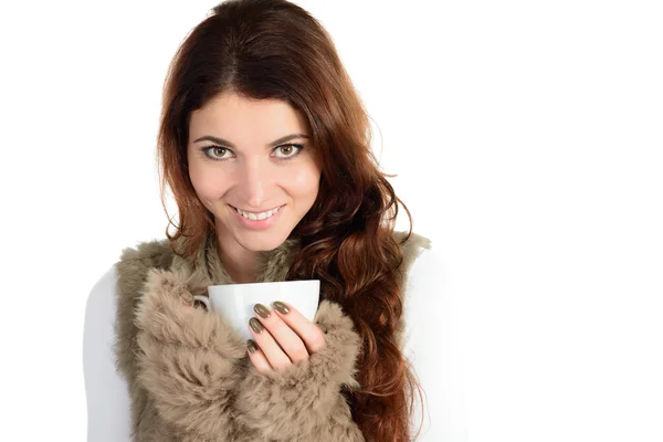 Beautiful woman in fur with cup of beverage — Stock Photo, Image