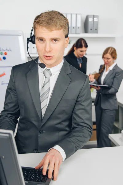 Businessman working in call center — Stock Photo, Image