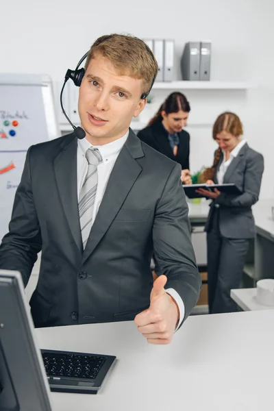 Businessman working in call center — Stock Photo, Image