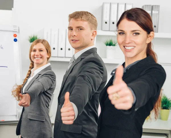 Three person standing in line an shows thumb up — Stock Photo, Image