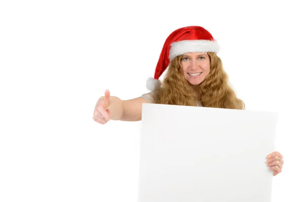 Attractive young woman with rad hair in santa hat holding blank — Stock Photo, Image