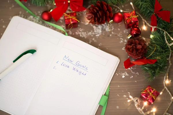 New Goals written at notebook with christmas decorations — Stock Photo, Image
