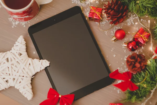 Tablet with a new year decoration — Stock Photo, Image