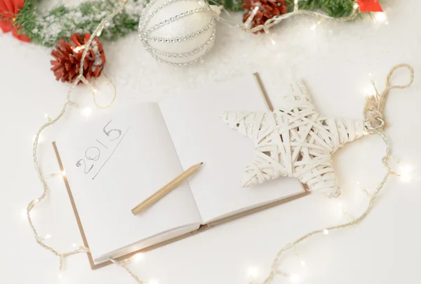 2015 written at notebook with christmas decorations — Stock Photo, Image